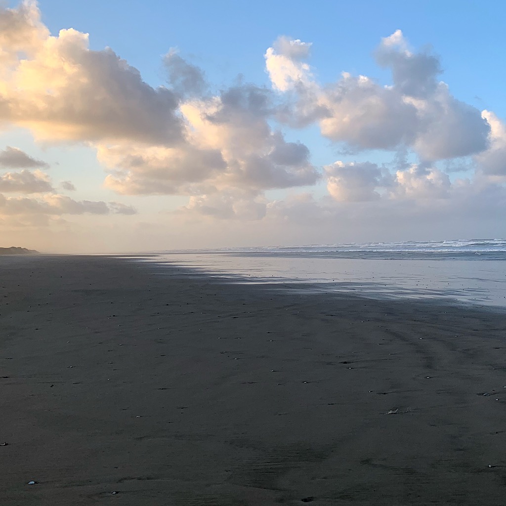 Early morning sunlight on clouds above Ninety Mile Beach.