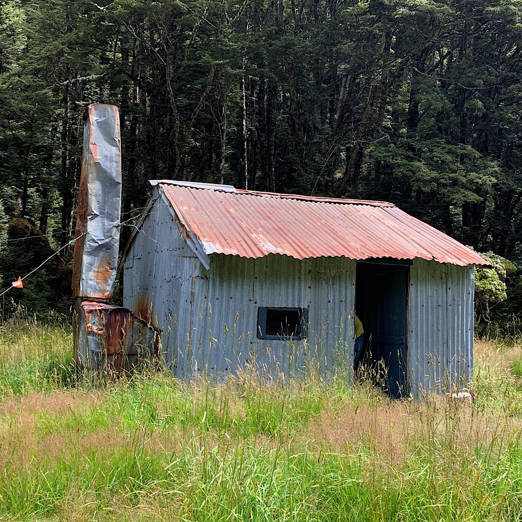 The tiny West Harper Hut is barely a shelter of corrugated metal and dirt floor. 
