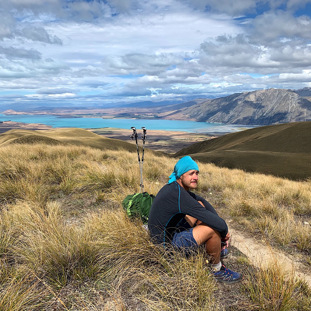 Tom appears dressed to match Lake Tekapo. This was his last section of the South Island before he flew to Wellington and walked the North Island. 