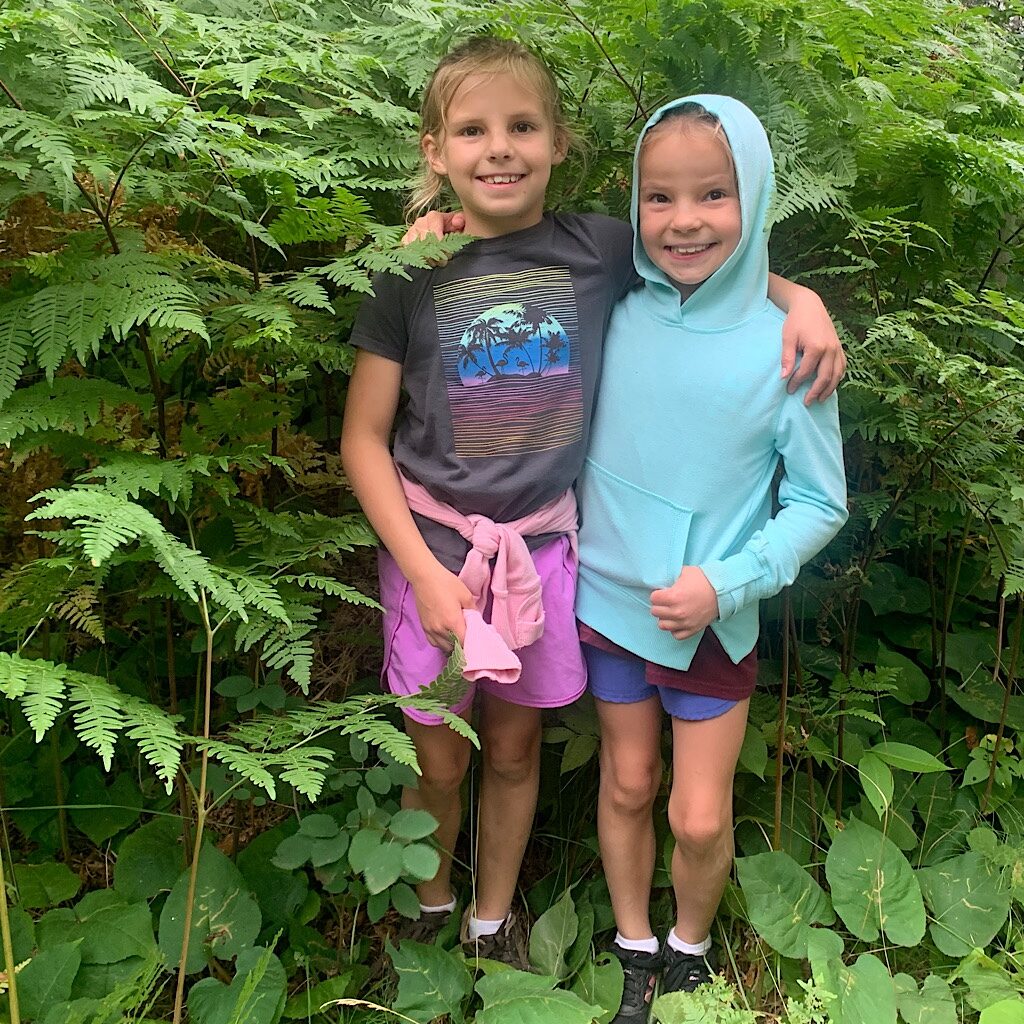 Happy little hikers engulfed in ferns. 