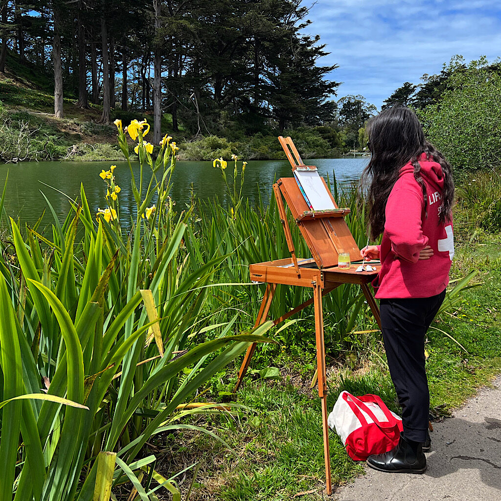 An artist works en plein air at Stow Lake in Golden Gate Park. 
