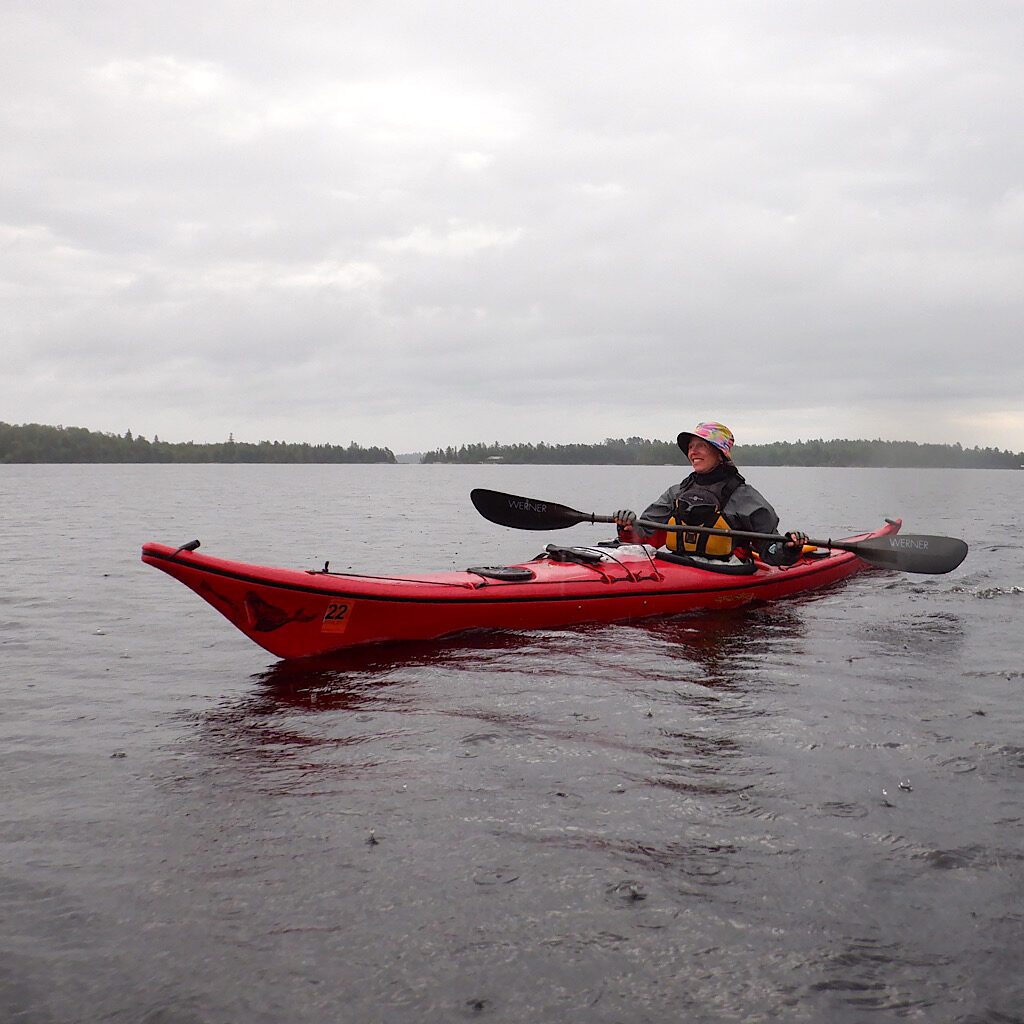 Paddling with big, splashy raindrops on Namakan Lake - kayaking is, after-all, all water sport.